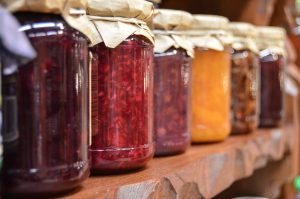 Image of a shelf of preserves and jellies.