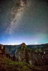 Image of stars in the sky at night over Yosemite. 
