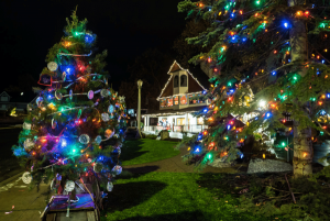 Image of a house and front yard decorated for Christmas.