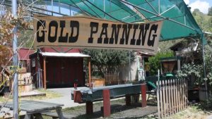 Image of a gold panning sign at Coarsegold Historic Village. 
