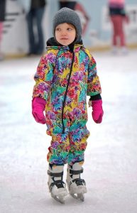 Image of a young child ice skating.