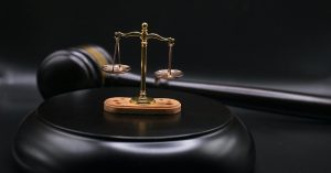 Image of a gavel and the scales of justice.