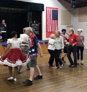 Image of people square dancing.