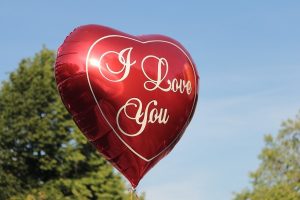 Image of a metallic balloon that says "I Love You" on it. 