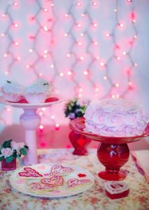 Image of Valentine's Day cookies and cake on a table. 