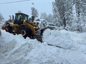 Image of Heavy Equipment Tractor Moving Snow