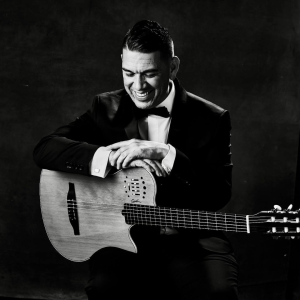 Image of Mikel Soria holding a guitar