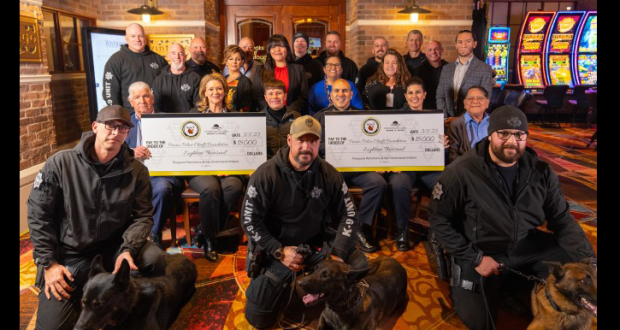 Image of the Fresno Police Department receiving oversized sponsorship checks from the Chukchansi Cares Program.