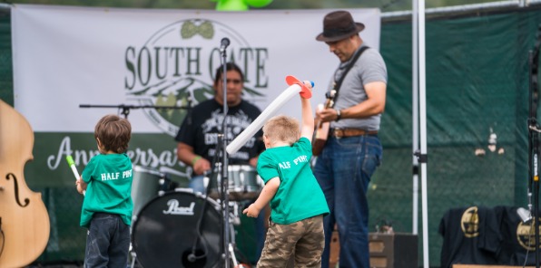 Image of kids having fun next to a band playing at South Gate Brewery