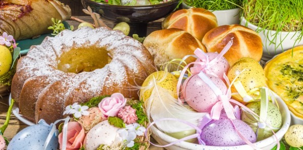 Image of Easter eggs next to a bunt cake and decorations