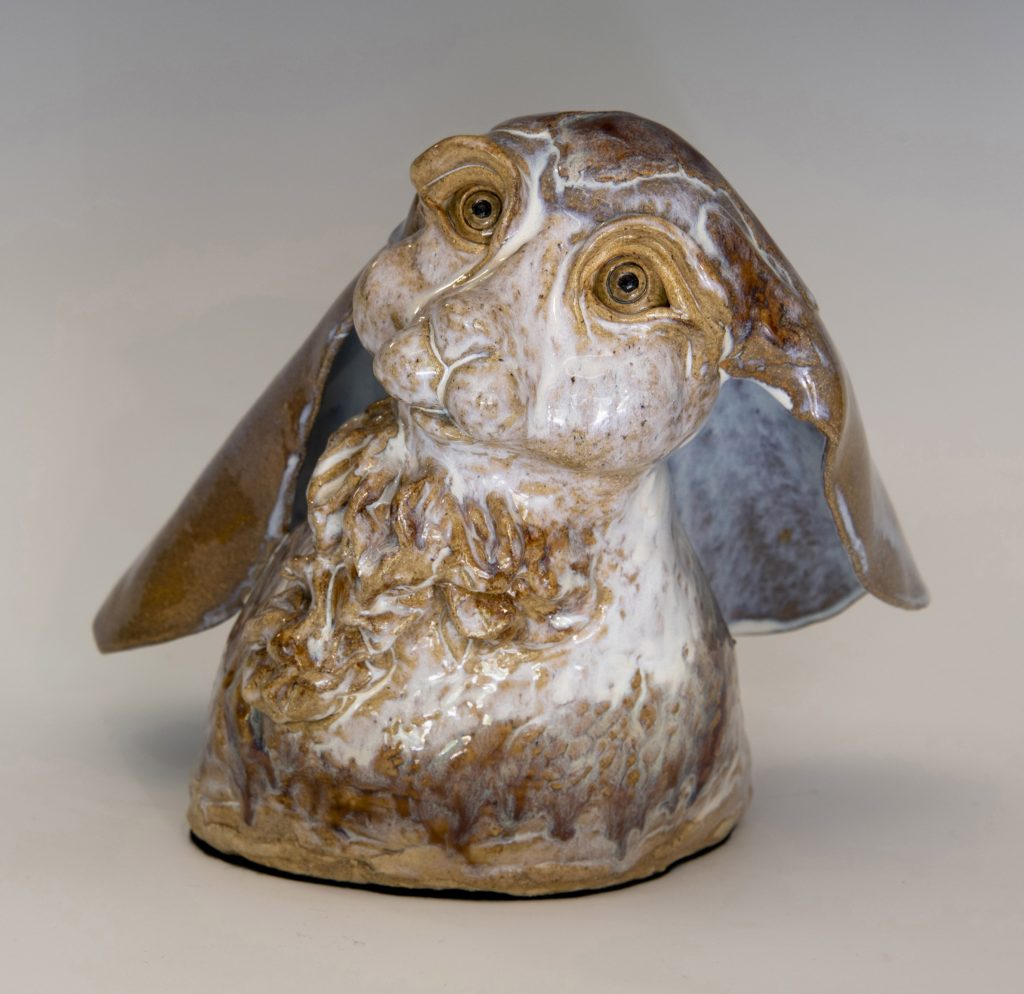 Phoebe Bryan’s ceramic sculpture depicts a rabbit lost in thought in a moment of
peaceful contemplation.