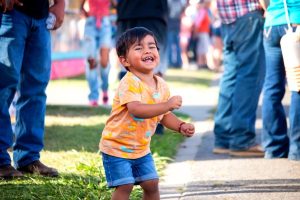 Image of a young boy dancing at the Merced County Fair.