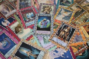 Image of a deck of Tarot cards spread out on a table.