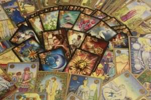 Image of Tarot cards spread out on a table.