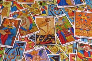 Image of Tarot cards spread out on a table. 