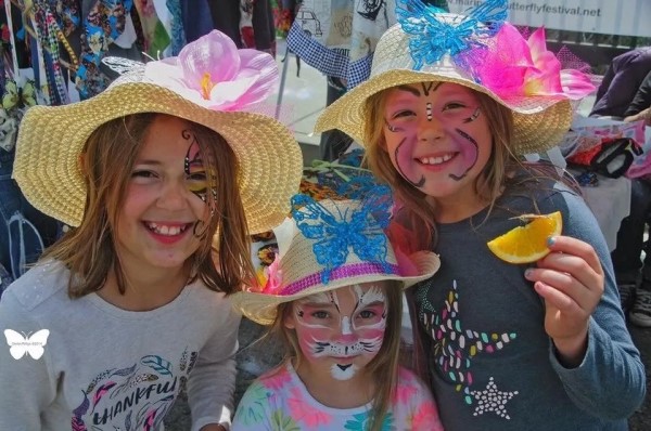 Image of three young children at the Butterfly Festival. 