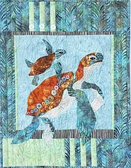 Image of a wall hanging showing a mother turtle with a baby.