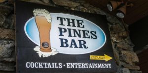 Image of the Pines Bar Sign.