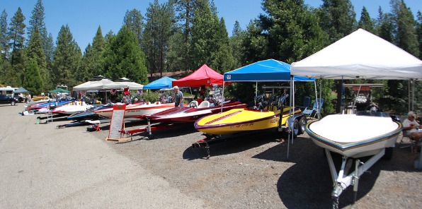 Image of the bass lake boat hot rod show. lots of color boats lined up on a parking lot