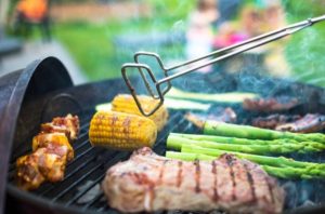 Image of food being cooked on a grill.