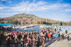 Image of triathlon swimmers getting ready to enter the water at Bass Lake.