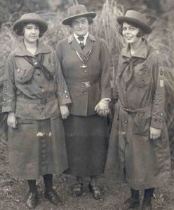 Image of Juliette Gordon Low with two Girl Scouts.