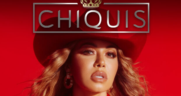 Image of Chiquis in a red cowboy hat