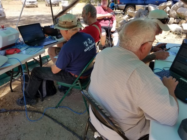 Image of ham operators at a field day event. 
