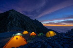 Image of tents outside at night.
