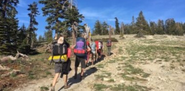 Image of a group of people hiking with backpacks