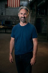 american pickers mike wolfe wearing a blue shirt