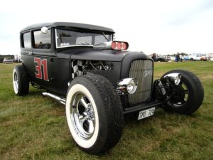 Black Classic Car in the grass