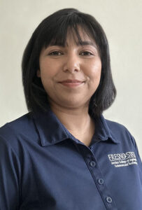 Dr. Sangeeta Bansal wearing a navy blue collared shirt