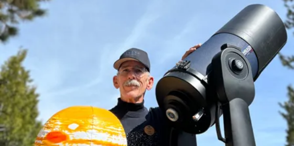 Image of a guy with a telescope