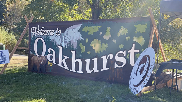 The newly restored Welcome To Oakhurst sign was unveiled at the Oakhurst Fall Festival this past weekend