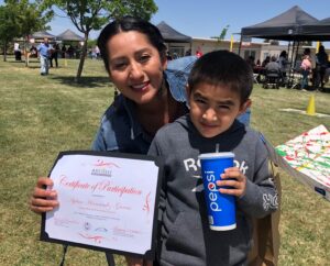 Picture of student and proud parent at Art Fest Madera County.