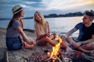 Friends around campfire