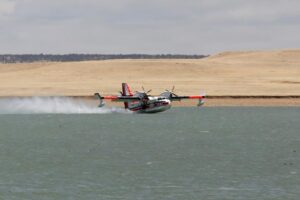 Picture of USFS plane landing on water.