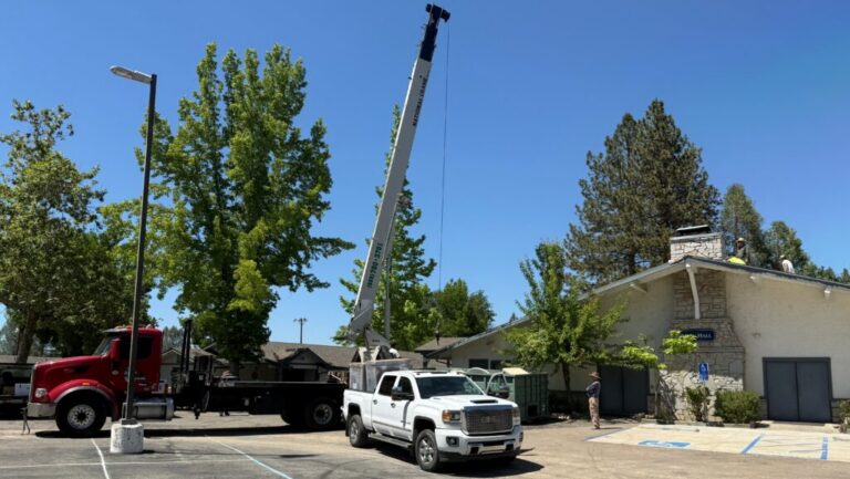 Photo of roof work being completed at the Oakhurst Community Center.