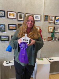 Photo of Karen Mentzer with her blue ribbon.