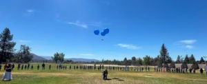 Photo of current and former North Fork Elementary students gather to celebrate the return of letters launched into the sky in 1990 and rediscovered 36 years later in the High Sierra.
