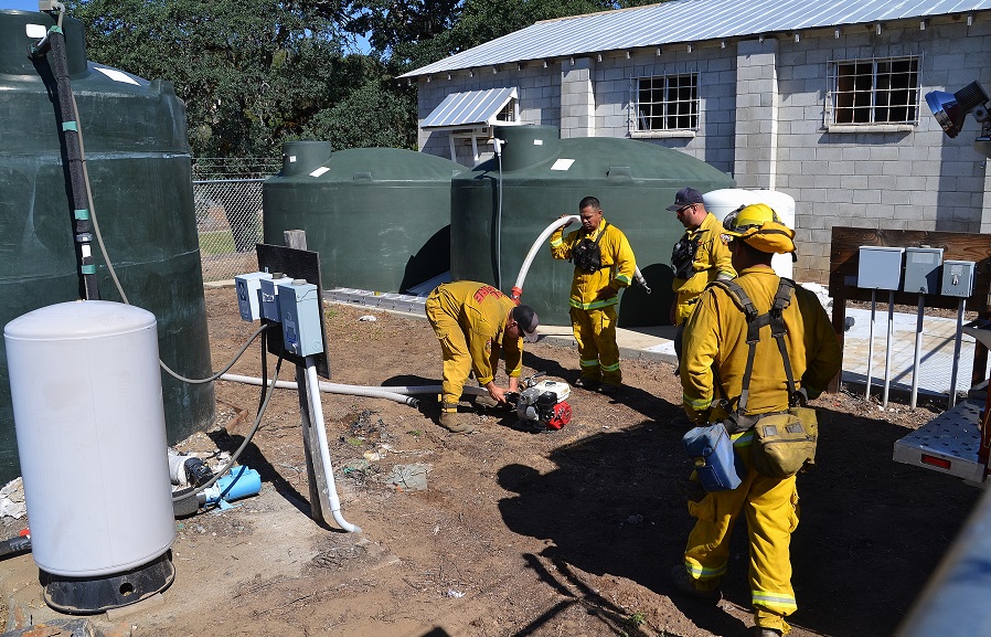 Using pump to access home water storage tank - photo by Gina Clugston