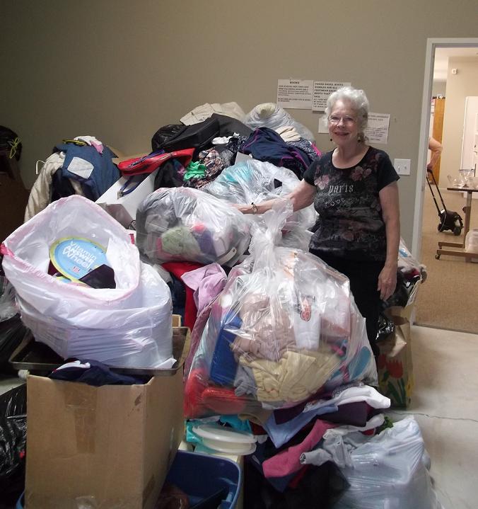 Pat Sebring sorts through donations at Manna House