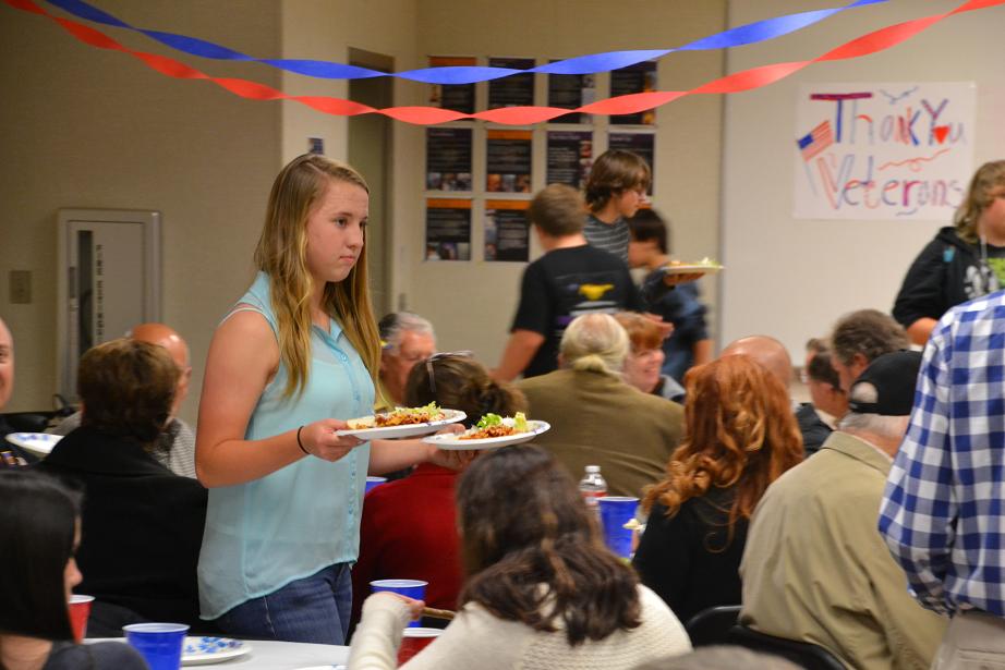 Students serve dinner to veterans - photo Gina Clugston