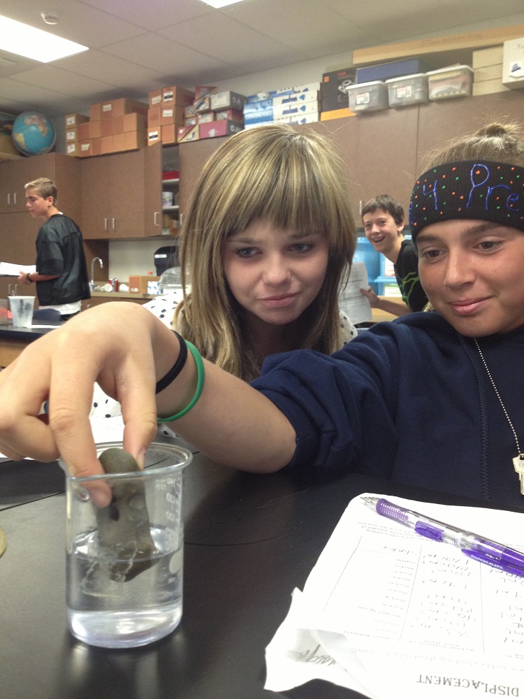Wasuma students study in science class -Skylar Fruehe and Charlotte Borough with photo bomb in the back by Noah Allen - photo courtesy of Wasuma School