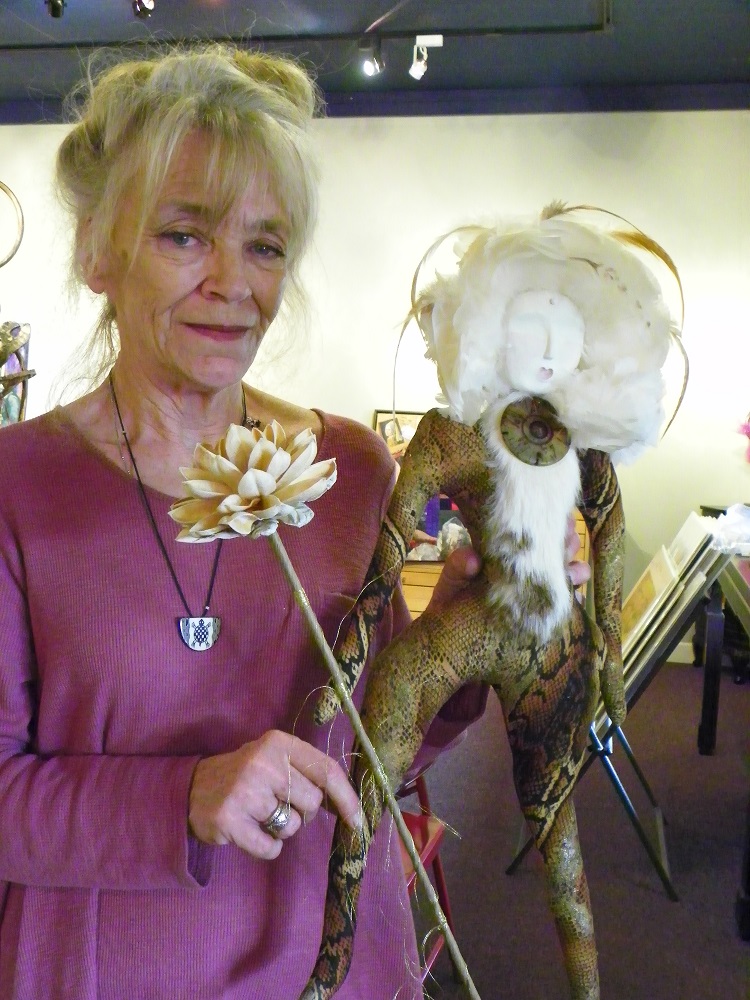 Artist Julie Mitchell holds one of her pieces for exhibit with The Figure Revealed at Stellar Gallery - photo by Kellie Flanagan Feb 2015