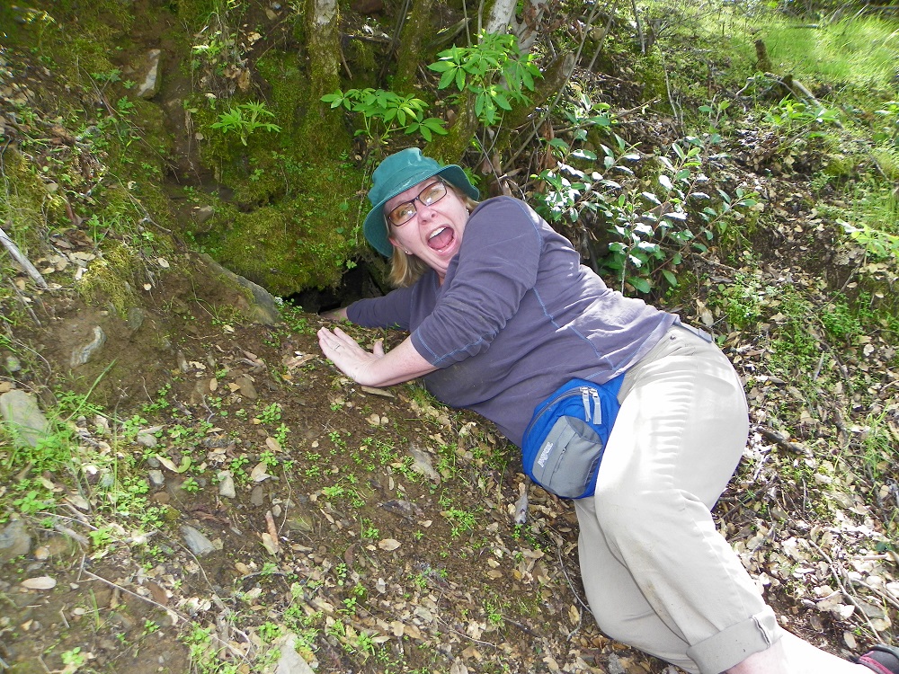 Kellie reaches into an old mine for her pot of gold and comes up empty but happy - photo by Tamara Manieri