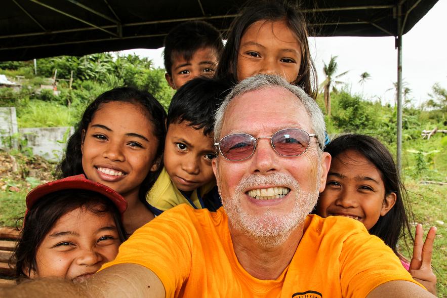Jay York makes new friends helping out after a typhoon in the Philippines - photo by Jay York