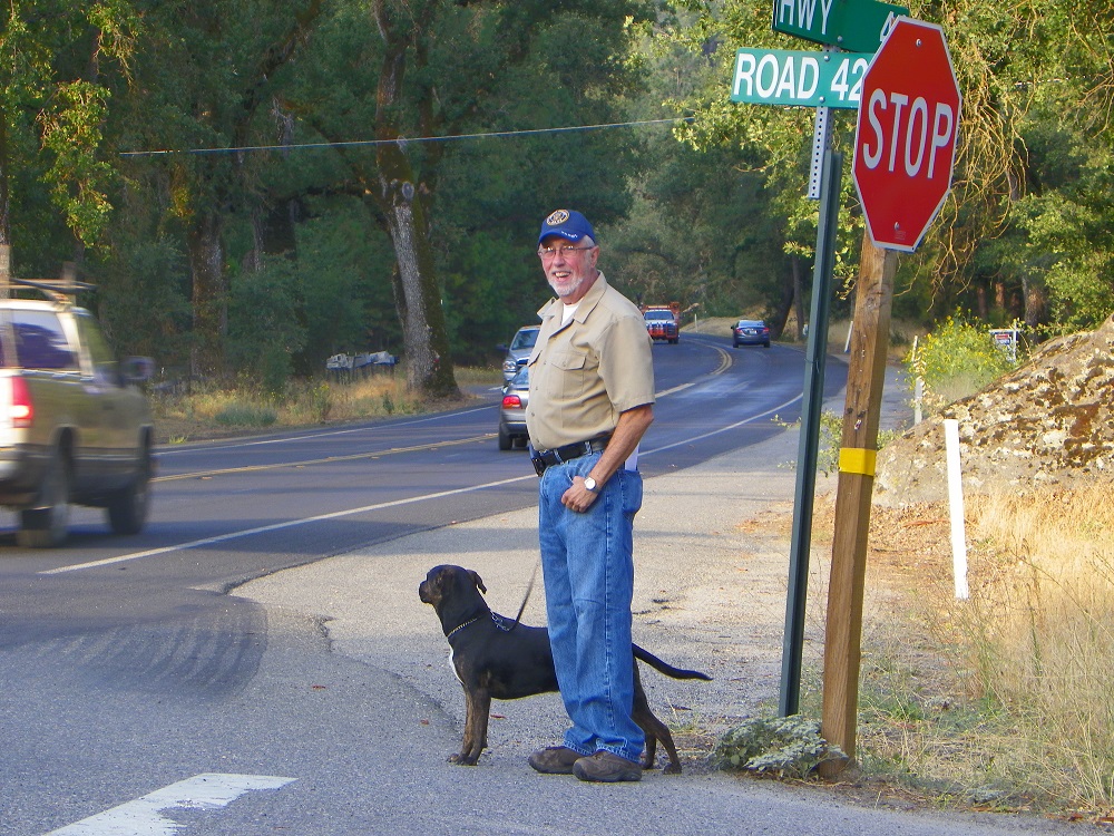 Waving Man Bill Briggs with dog Buddy - 2013 - photo by Kellie Flanagan